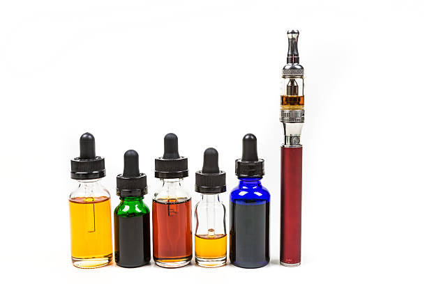istock Assorted flavors of vape juice and an ecigarette 636388020