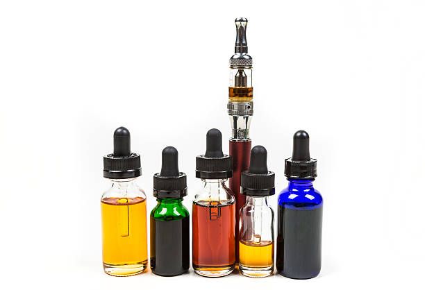istock Assorted flavors of vape juice and an ecigarette 636388036