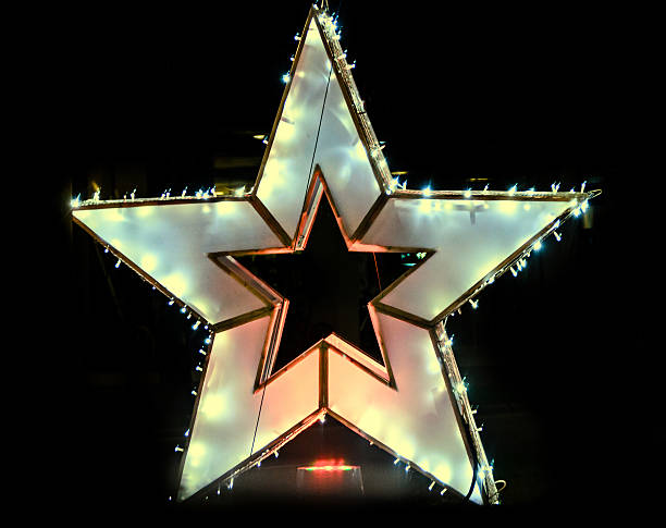 istock Colored Christmas star lights and ornaments 636388658