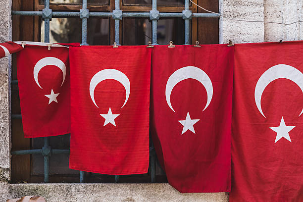 istock Turkish flags of various sizes hanging on the wall 636391302
