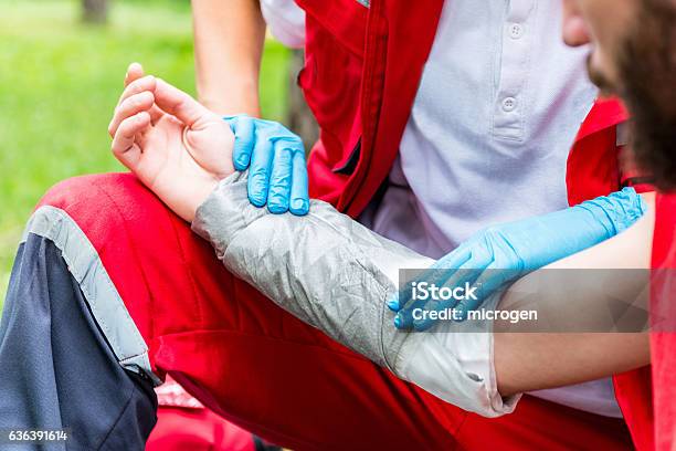 Treating Burn Injury Putting Bandage Stock Photo - Download Image Now - Burning, Physical Injury, Misfortune