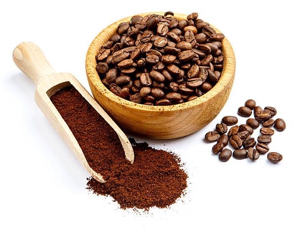 istock coffee beans in bowl isolated on white background 636391900