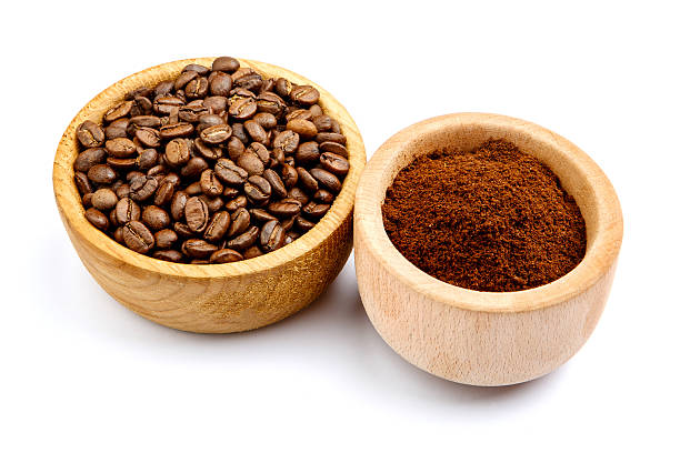 istock coffee beans in bowl isolated on white background 636392032