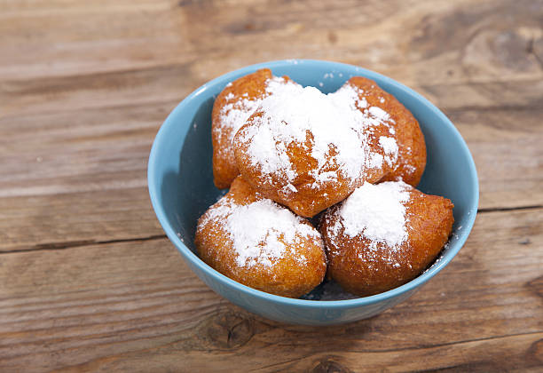 istock Traditional Dutch oliebollen on wooden background 636399684