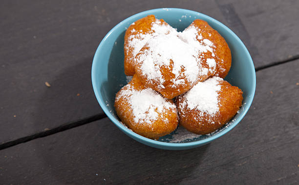 istock Traditional Dutch oliebollen on wooden background 636399696