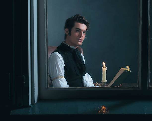istock Vintage victorian man sitting by rainy window reading book. 636399904