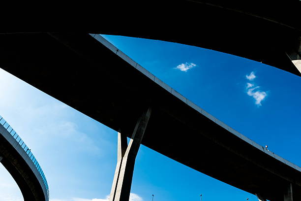 istock Silhouette of highway ramps on a sunny day 636400036