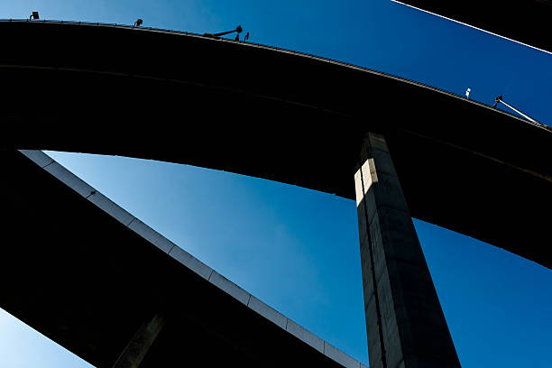istock Silhouette of highway ramps on a sunny day 636400076