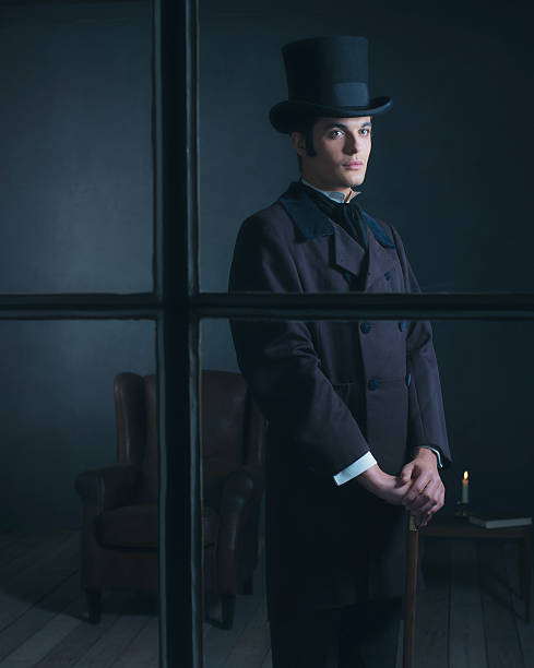 istock Dickens style man standing with cane behind window. 636400138