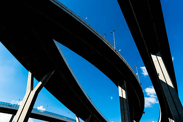 istock Silhouette of highway ramps on a sunny day 636400142