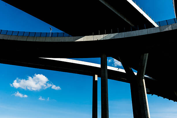 istock Silhouette of highway ramps on a sunny day 636400178