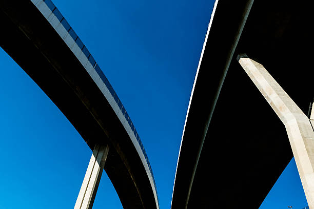 istock Silhouette of highway ramps on a sunny day 636400200