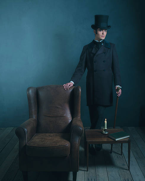istock Retro dickens style man standing with cane next to chair. 636400224