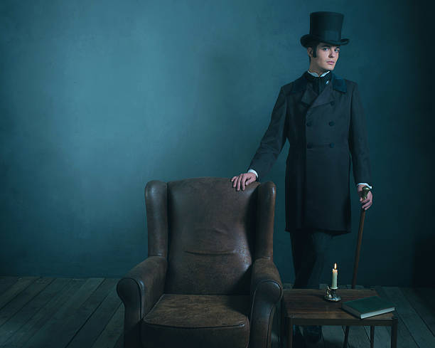 istock Retro dickens style man standing with cane next to chair. 636400232