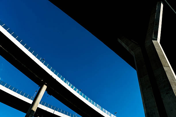 istock Silhouette of highway ramps on a sunny day 636400236