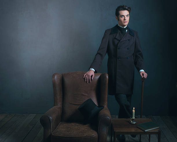 istock Retro dickens style man standing with cane next to chair. 636400296