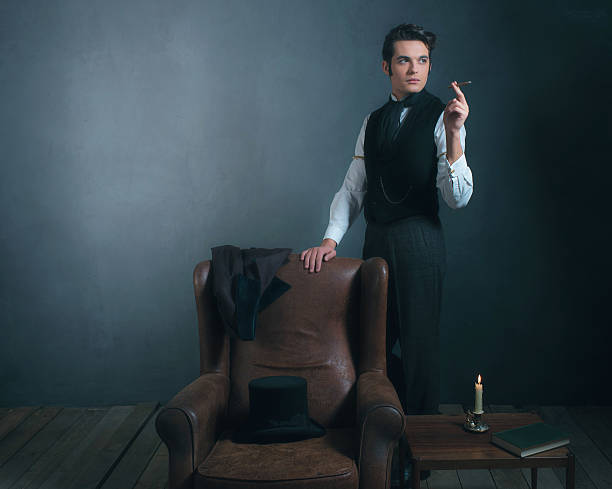 istock Vintage victorian man standing next to chair smoking cigarette. 636400346