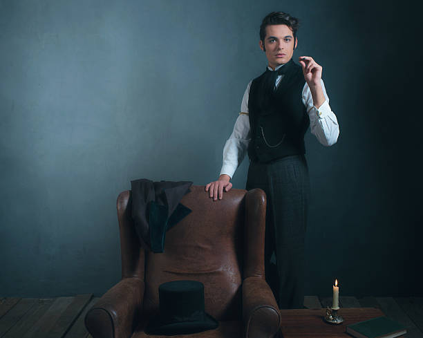 istock Vintage victorian man standing next to chair smoking cigarette. 636400368