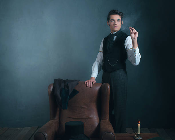 istock Vintage victorian man standing next to chair smoking cigarette. 636400392