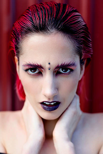 istock Attractive young woman with colorful makeup 636400722