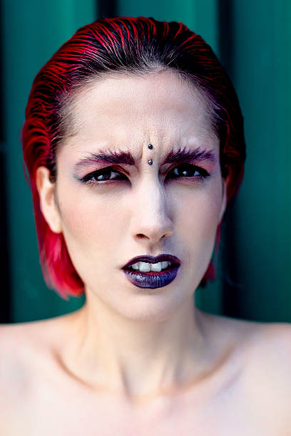 istock Attractive young woman with colorful makeup 636400812