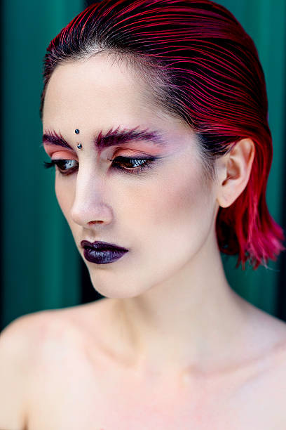 istock Attractive young woman with colorful makeup 636400854