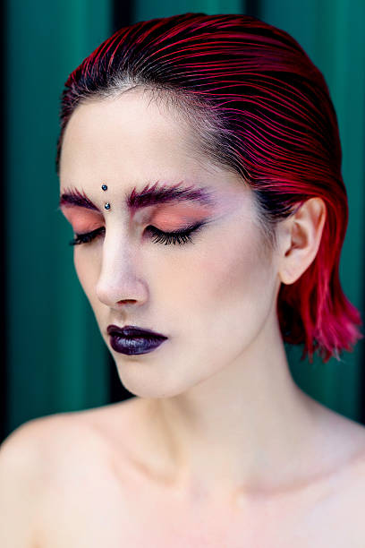 istock Attractive young woman with colorful makeup 636400902