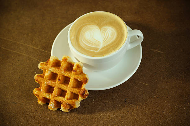 Hot coffee cafe latte with waffle