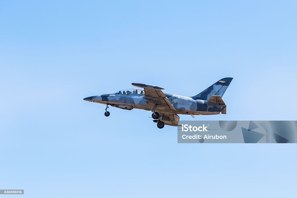 fighter jet flying on blue sky fighter jet flying on blue sky background Air Vehicle Stock Photo