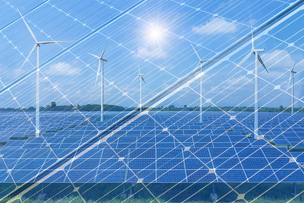 istock Double exposure solar panels with wind turbines 636407042
