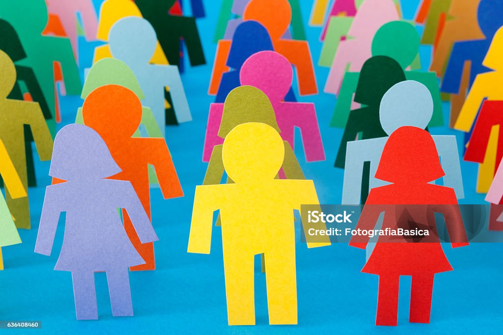 Rows of multicolored people Lots of paper stick figures of boys and girls standing in rows Stick Figure Stock Photo