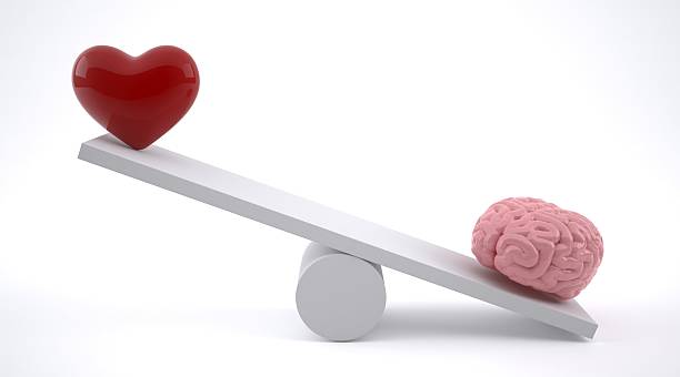 istock Brain and heart on a balance scale. 636408948