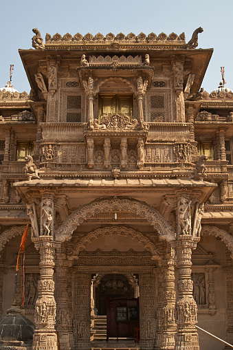 Ornately carved stonework of the entrance to the Hutheesing Temple in Ahmadabad, Gujarat, India. Jain temple built circa 1848.