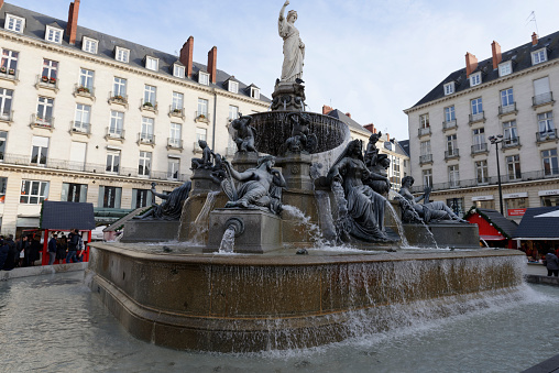 Nantes, France- December 7, 2016: The Fountain of The Place Royale Nantes is a sculptural group composed of six allegorical figures, representing the city of Nantes, the Loire river and its tributaries. The fountain has been renovated twice since the second World War, during which it was damaged by bombings.
