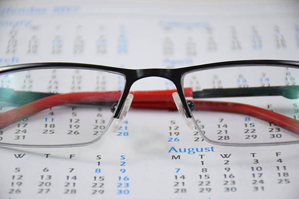 istock Calander and  pair of spectacles - 1 636419882