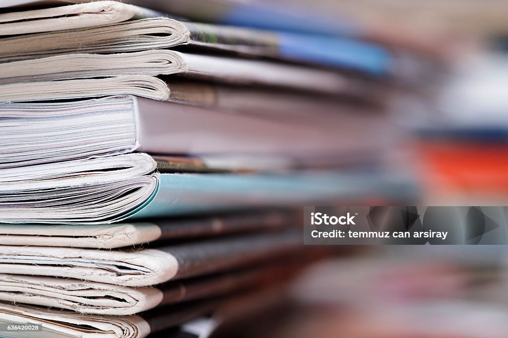 Stack of newspaper and magazines with copy space Stack of newspaper extreme close up with copy space. Magazine - Publication Stock Photo