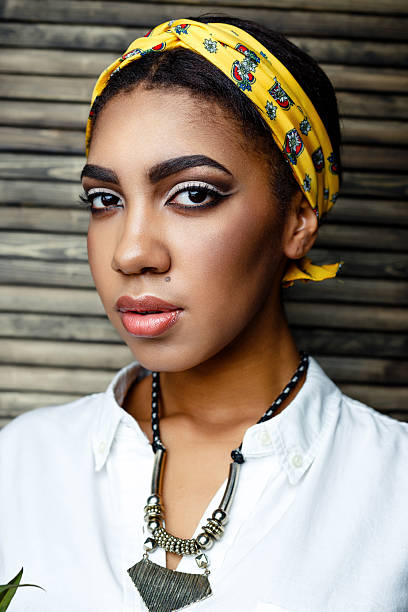 istock african- american  female model with flower 636420370