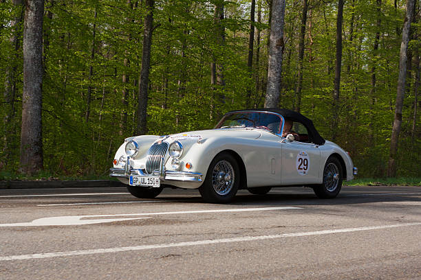 1958 Jaguar XK 150 S at the Wurttemberg Historic Rallye Heidenheim, Germany - May 4, 2013: Ulrich Kleinle and Werner Kleinle in their 1958 Jaguar XK 150 S at the ADAC Wurttemberg Historic Rallye 2013 on May 4, 2013 in Heidenheim, Germany. adac stock pictures, royalty-free photos & images