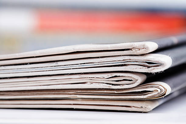 istock Stack of newspaper extreme close up with copy space 636420960