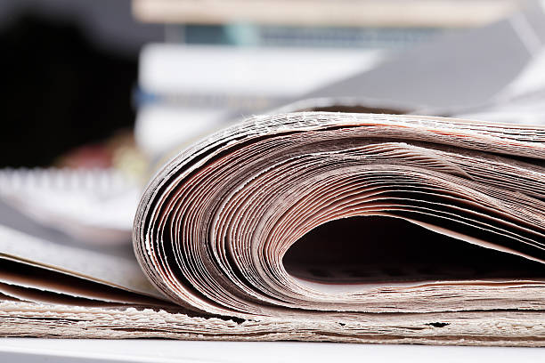 istock Stack of newspaper extreme close up with copy space 636421106