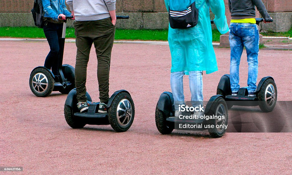 People move on segway Saint-Petersburg, Russia - December 24, 2016: Group of unrecognizable people move on segway. Segway Stock Photo