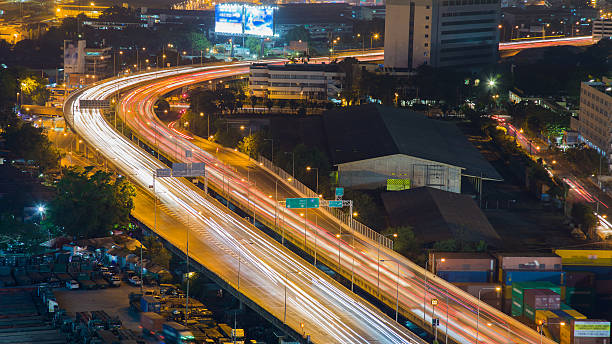 istock City highway curved light night view 636421530