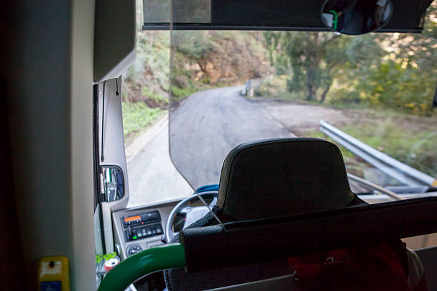 istock bus driving on the mountain roads 636424322