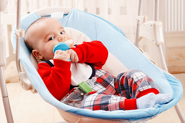 istock Cute baby eating fruit 636425376