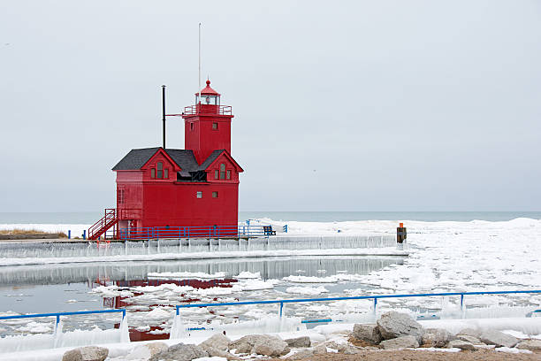 istock red Lake Michigan lighthouse in winter 636427524