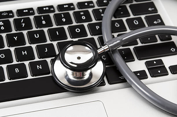 istock Stethoscope on a Keyboard of Laptop 636429144