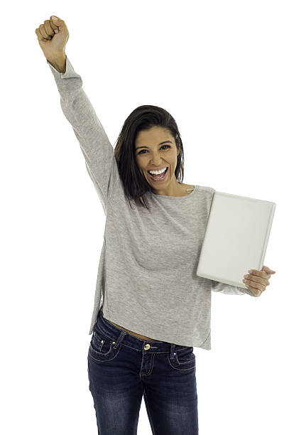 istock excited hispanic woman holding digital tablet pad smiling isolated 636431014