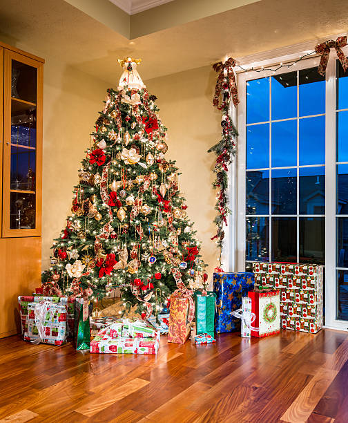 Wrapped presents under the Christmas tree in a cozy festive atmosphere