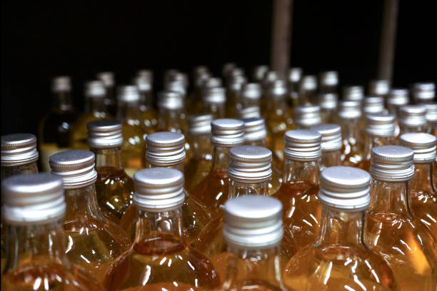 istock Glass bottles cover background 636436980