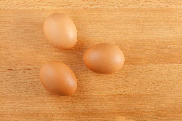 istock Home cooking concept, fresh organic eggs on wooden board backgro 636440232